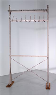 A large freestanding iron coat rack by 
																	 Fellner and Helmer